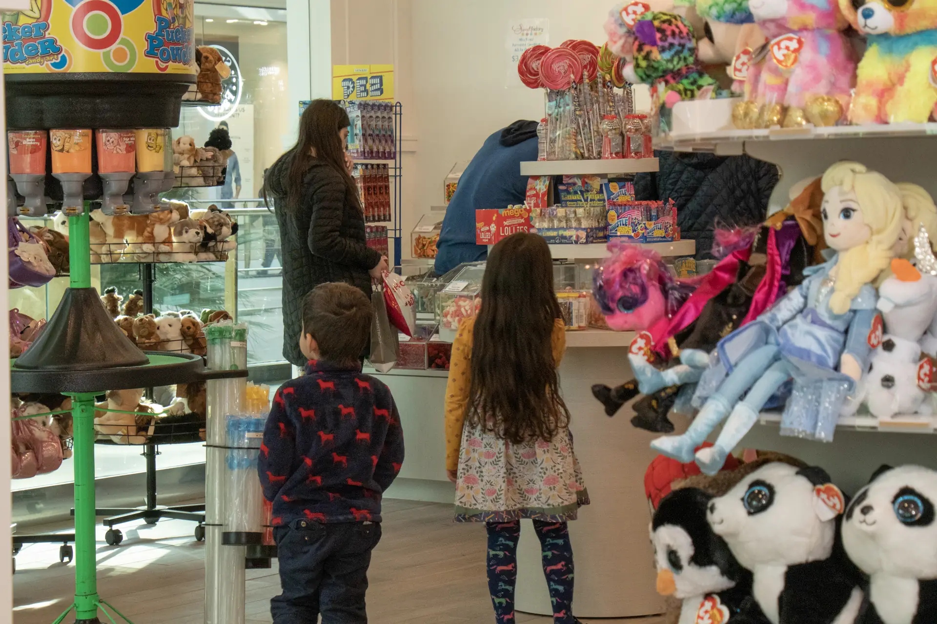 Family with young kids shopping at Sweet Factory, Somerset Mall, Troy Michigan