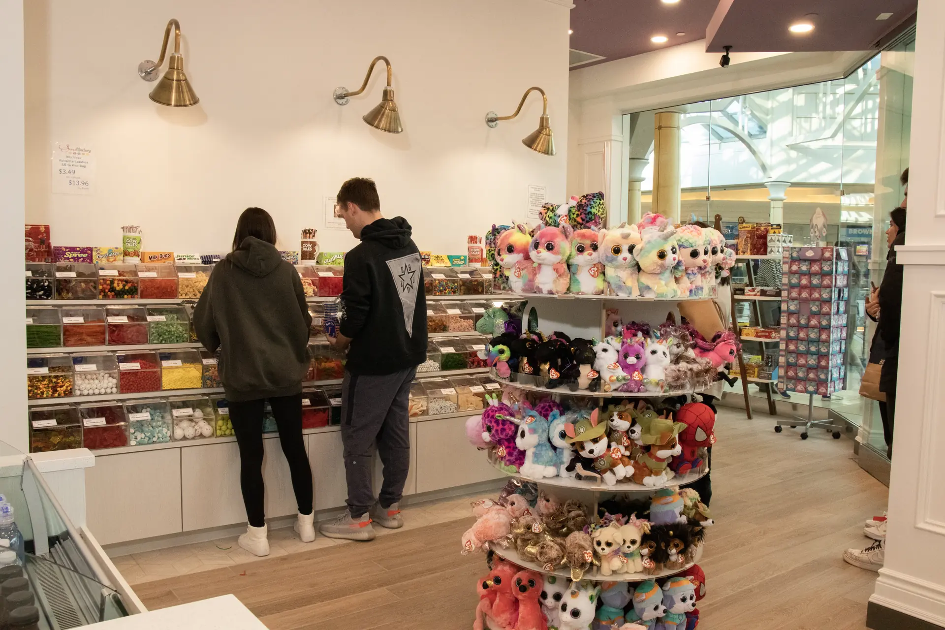 Couple shopping at the candy wall at Sweet Factory, Somerset Mall, Troy Michigan